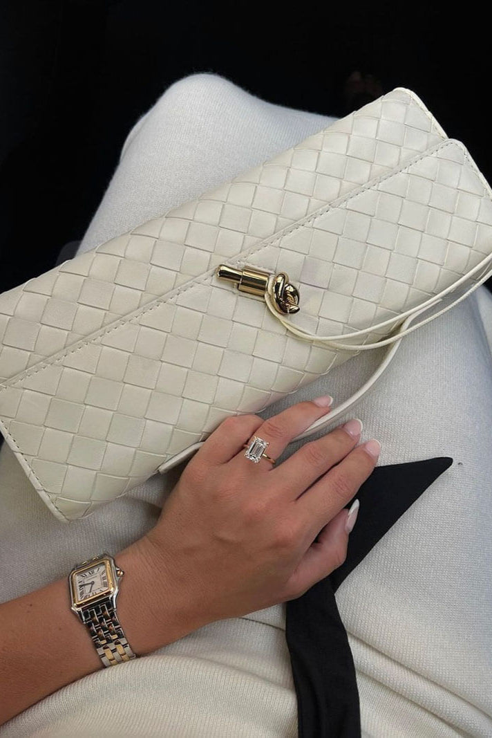 Melanie | Cartera de mano con lazo dorado